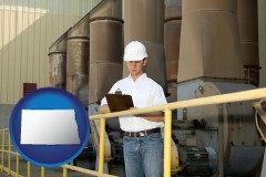 north-dakota map icon and a mechanical contractor inspecting an industrial ventilation system