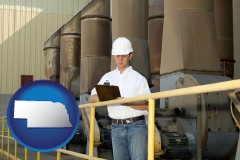 nebraska map icon and a mechanical contractor inspecting an industrial ventilation system