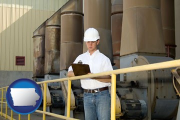 a mechanical contractor inspecting an industrial ventilation system - with Iowa icon