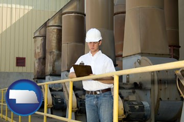 a mechanical contractor inspecting an industrial ventilation system - with Nebraska icon