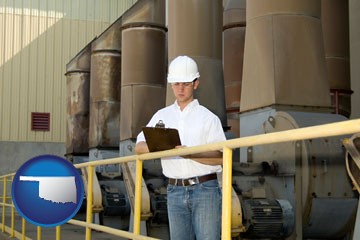 a mechanical contractor inspecting an industrial ventilation system - with Oklahoma icon