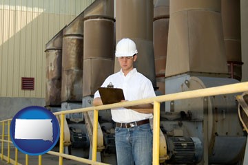 a mechanical contractor inspecting an industrial ventilation system - with South Dakota icon